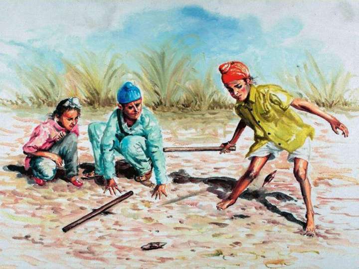 Indian boys playing gilli danda in rural Punjab