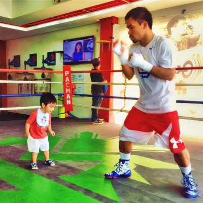 Manny Pacquiao in the ring with his toddler son