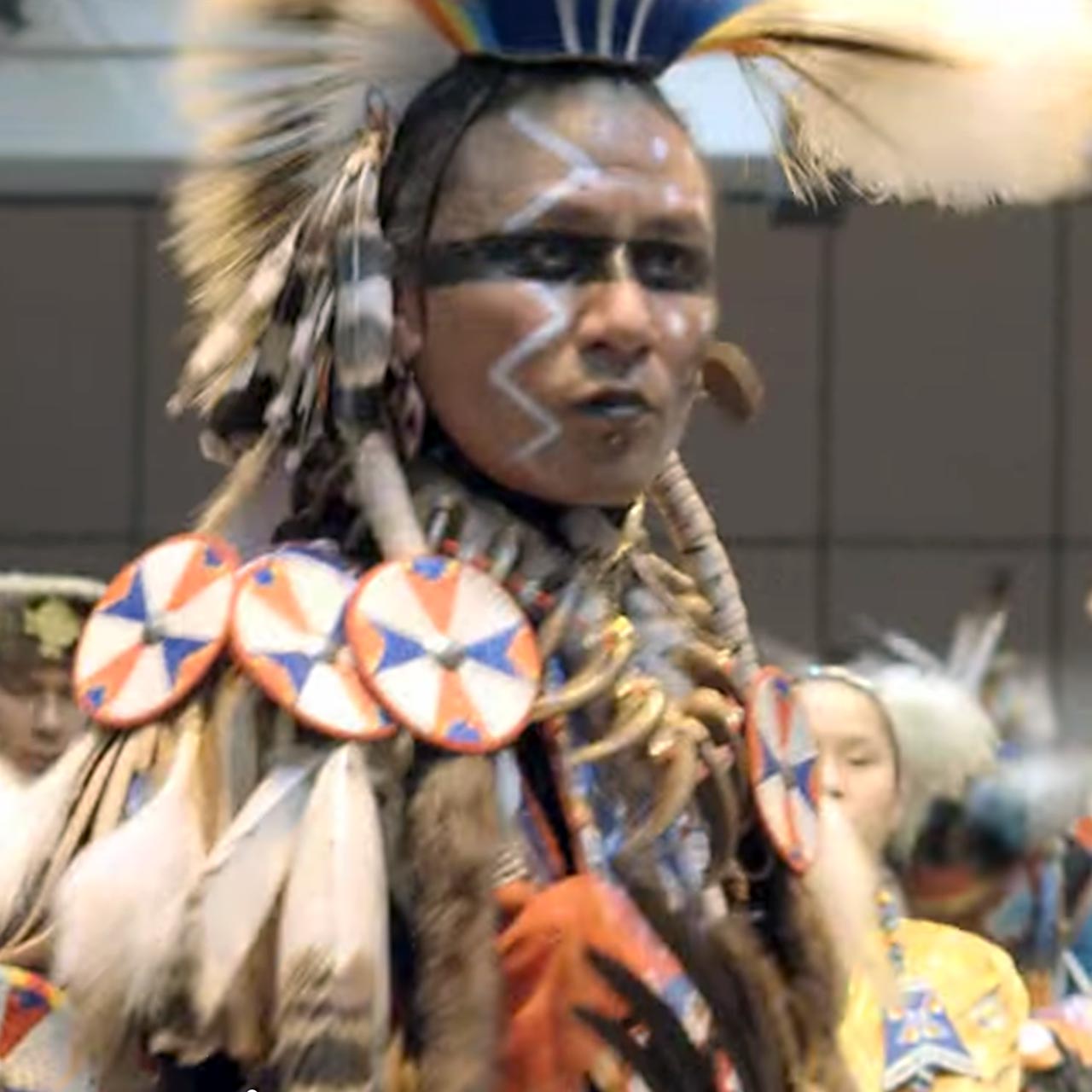 Mohawk warrior performing dance.