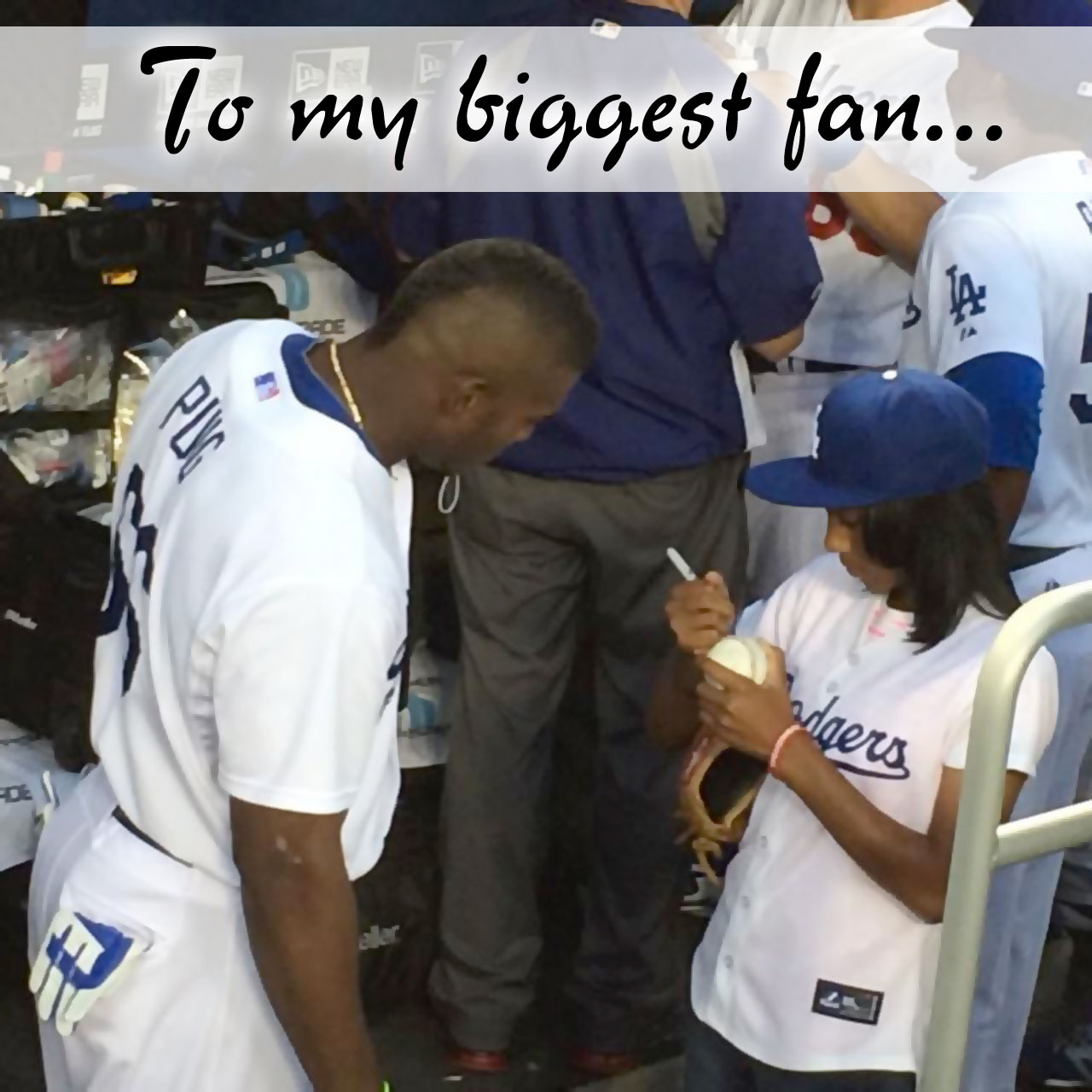 Mo'Ne Davis Signs a ball for Yasiel Puig in the Dodgers dugout.