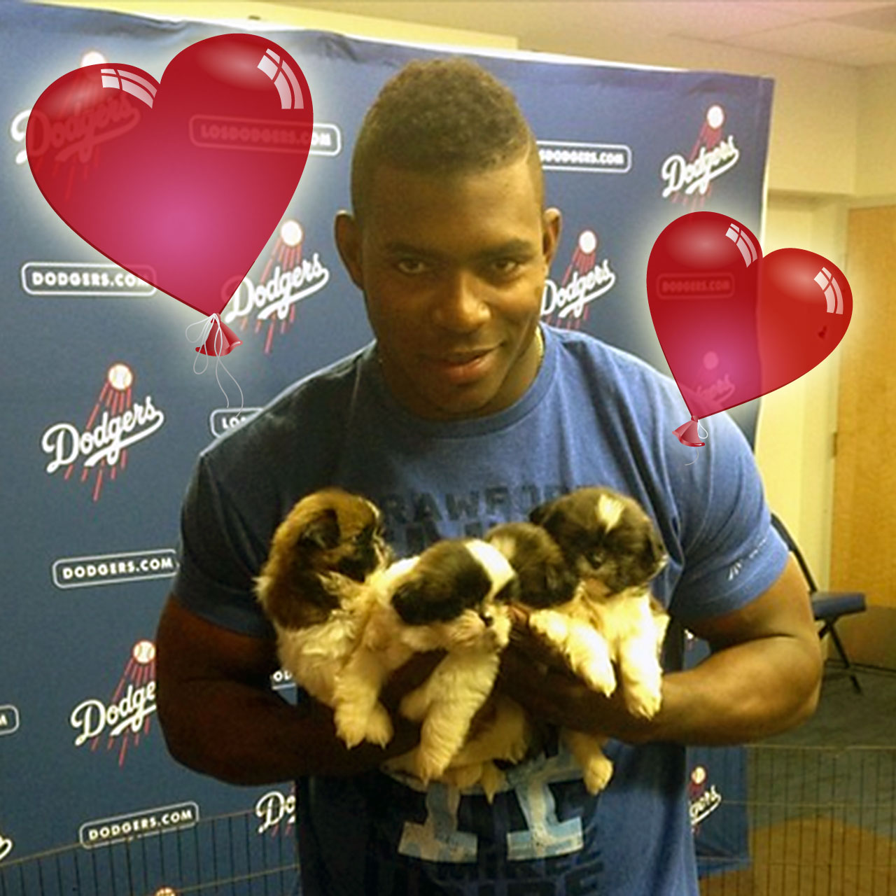 Yasiel Puig Poses with puppies