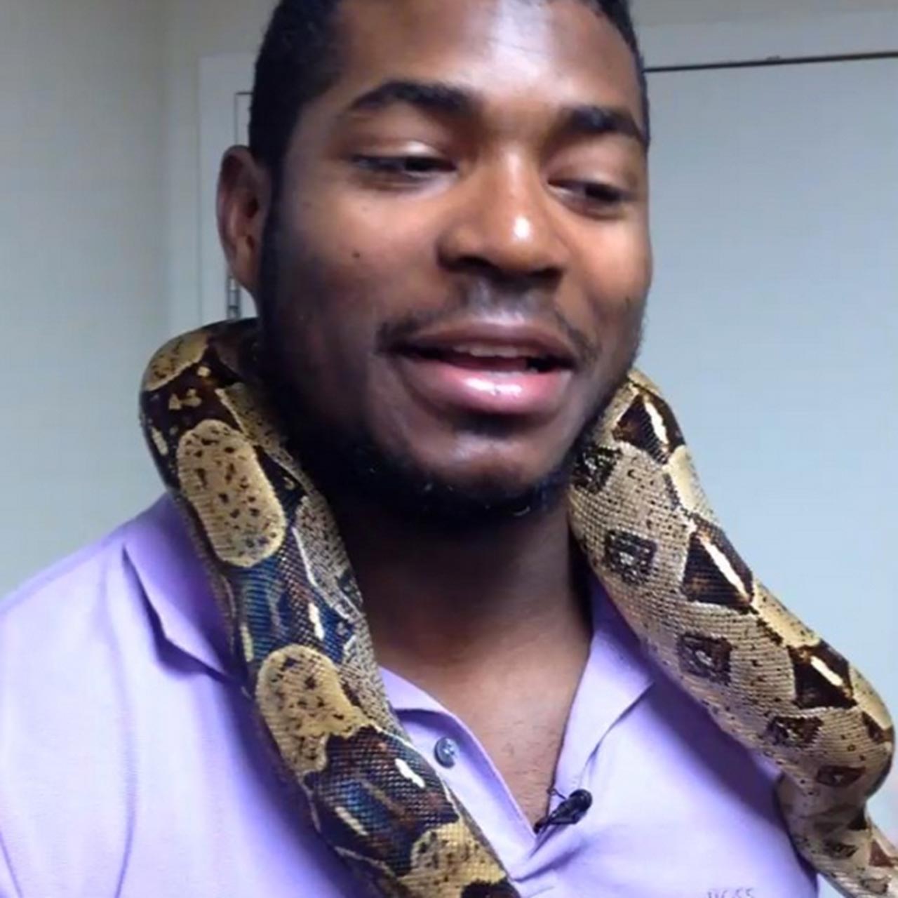 Yasiel Puig with a snake around his neck while visiting the Cincinnati Zoo.