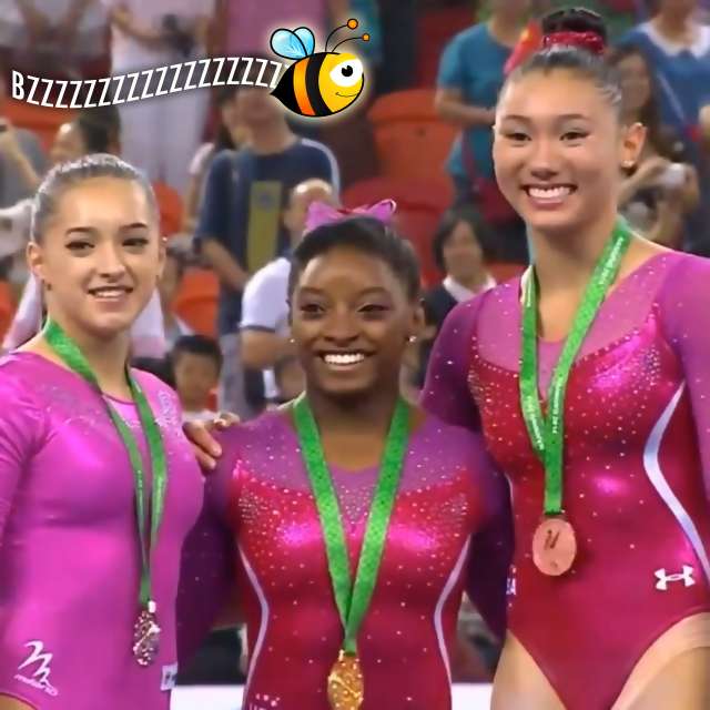 Bee buzzes Simone Biles and Kyla Ross