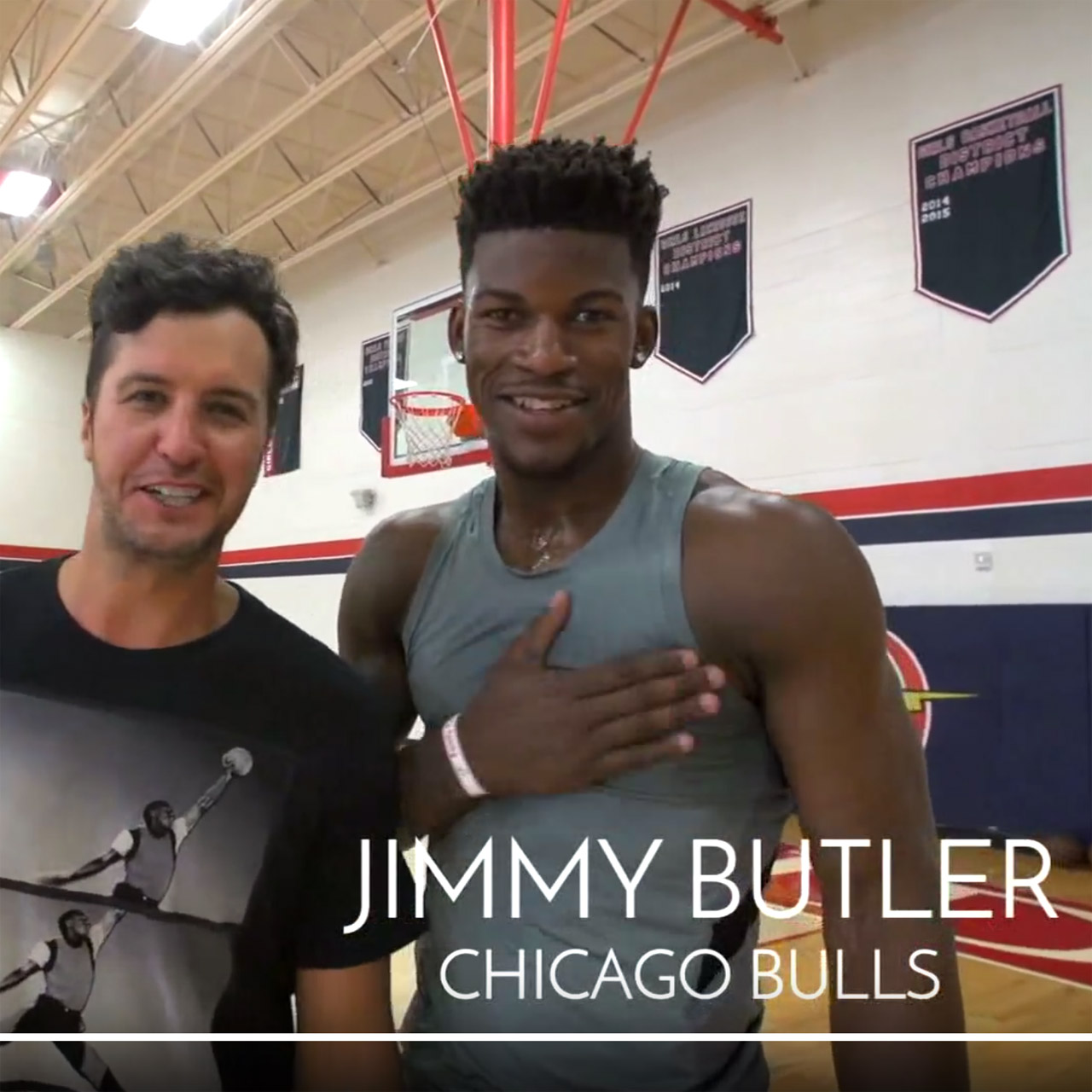 Bulls guard Jimmy Butler plays basketball against Luke Bryan in Florida