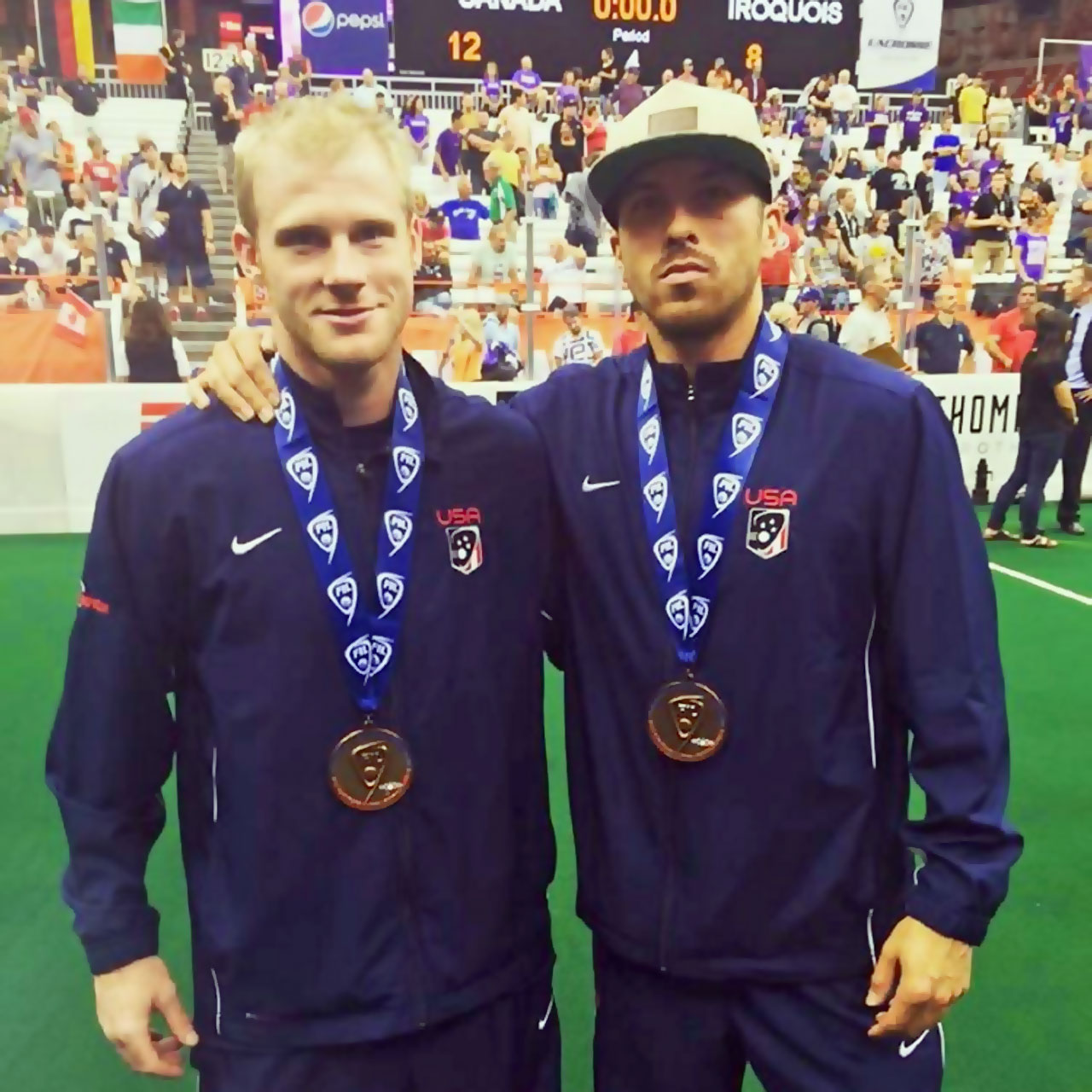 Joe Walters poses with Knighthawks teammate after winning bronze medal