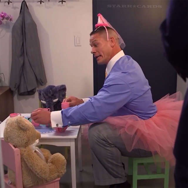 John Cena serving tea in a tutu