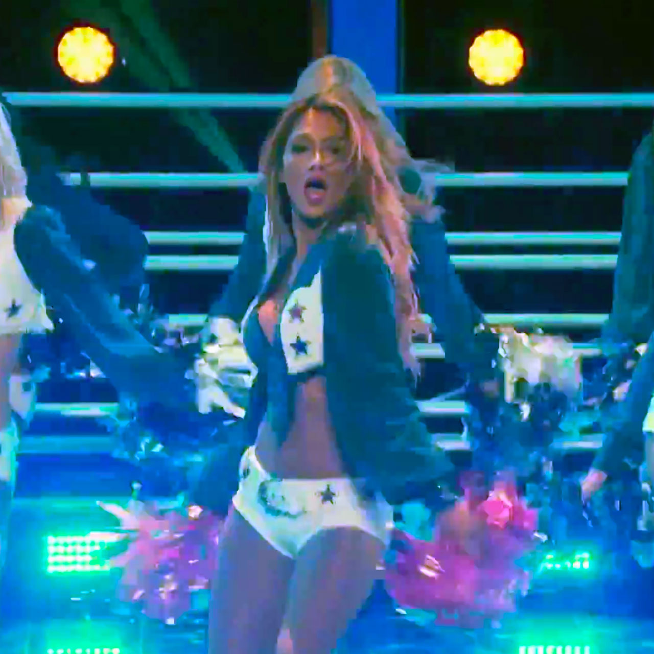Nicole Scherzinger performs with the Dallas Cowboys Cheerleaders