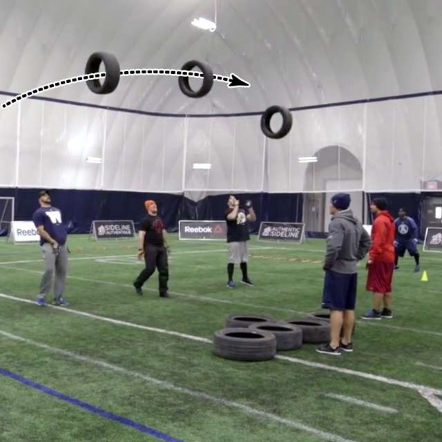 QB Mike Reilly throws football through tires