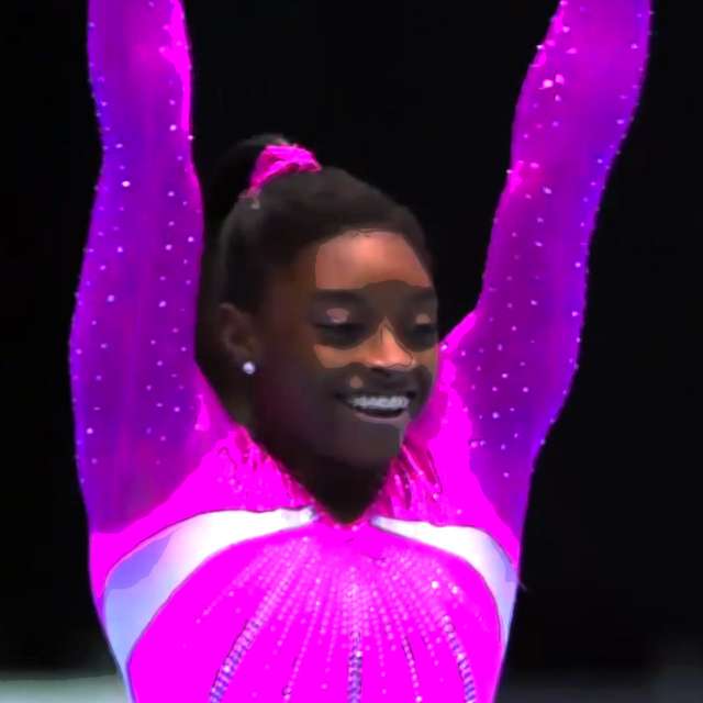 Simone Biles smiles after winning the floor event.